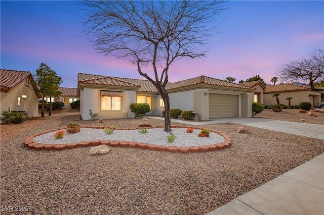 10309 Georgetown Pl, Las Vegas, NV 89134 - mediterranean / spanish house featuring an attached garage, driveway, stucco siding, and a tile roof