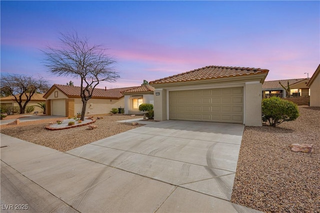 10309 Georgetown Pl, Las Vegas, NV 89134 - mediterranean / spanish house featuring stucco siding, driveway, a tile roof, and an attached garage