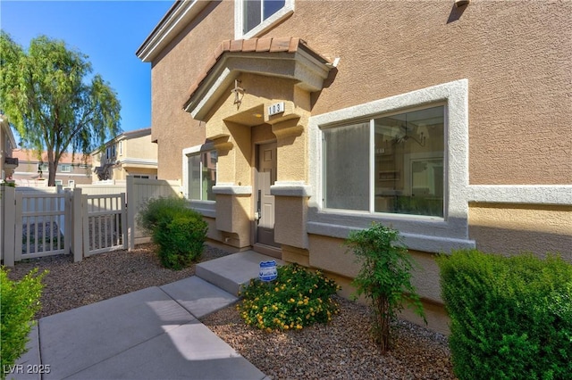 4779 Straight Flush Dr Unit 103, Las Vegas, NV 89122 - property entrance featuring stucco siding and a gate