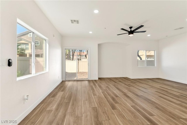 4779 Straight Flush Dr Unit 103, Las Vegas, NV 89122 - unfurnished living room with light wood finished floors, healthy amount of natural light, baseboards, recessed lighting, and a ceiling fan