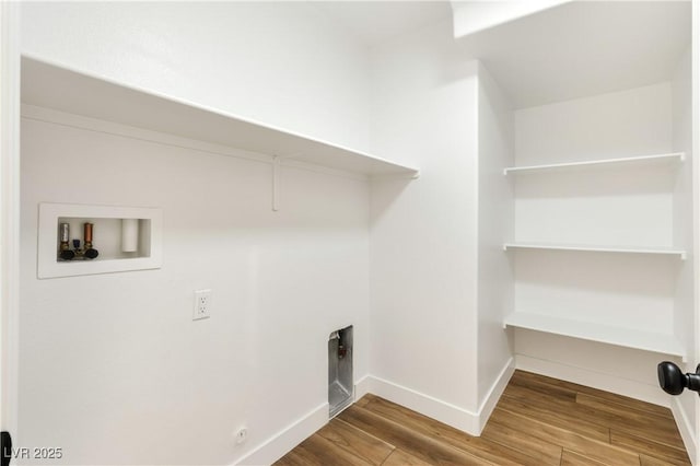 4779 Straight Flush Dr Unit 103, Las Vegas, NV 89122 - laundry area featuring wood finished floors, hookup for a washing machine, and baseboards