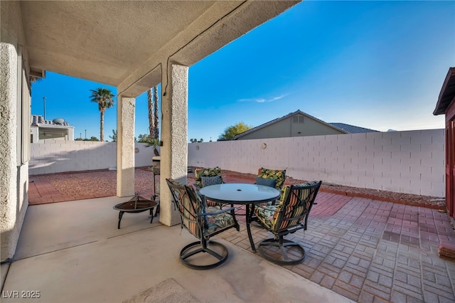 4005 Poppy Fields Dr, Las Vegas, NV 89129 - fenced backyard featuring outdoor dining space and a patio