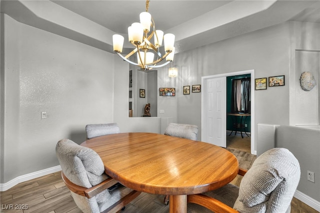 4005 Poppy Fields Dr, Las Vegas, NV 89129 - dining room with a chandelier, baseboards, and wood finished floors