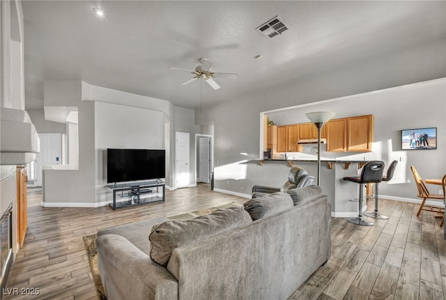 4005 Poppy Fields Dr, Las Vegas, NV 89129 - living room featuring wood finished floors, a ceiling fan, and baseboards