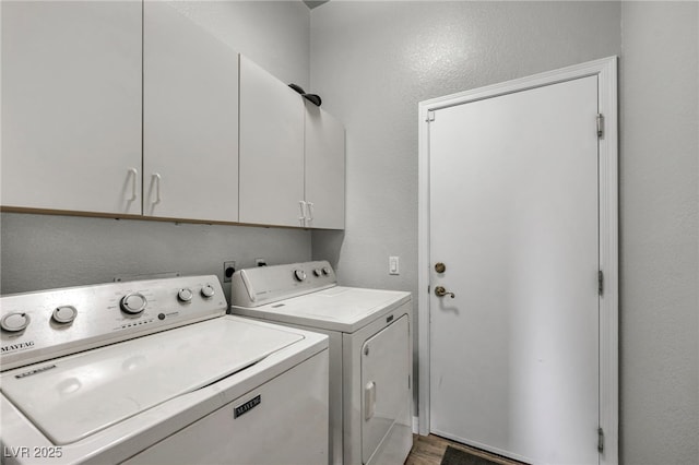 4005 Poppy Fields Dr, Las Vegas, NV 89129 - washroom featuring cabinet space, washing machine and dryer, a textured wall, and light wood-style flooring