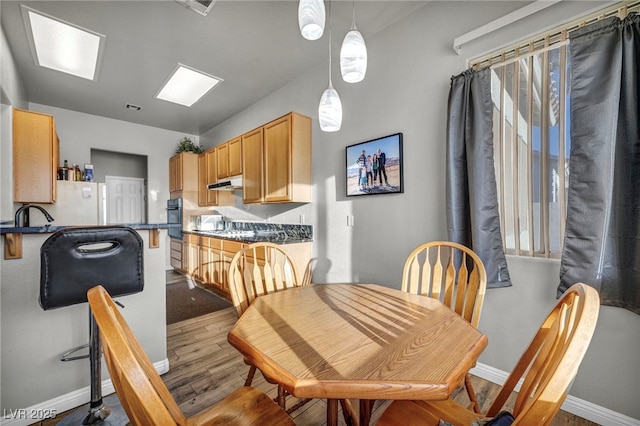 4005 Poppy Fields Dr, Las Vegas, NV 89129 - dining space with wood finished floors and baseboards