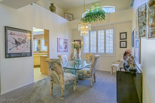2437 Desert Butte Dr, Las Vegas, NV 89134 - dining space with healthy amount of natural light, a chandelier, and light carpet