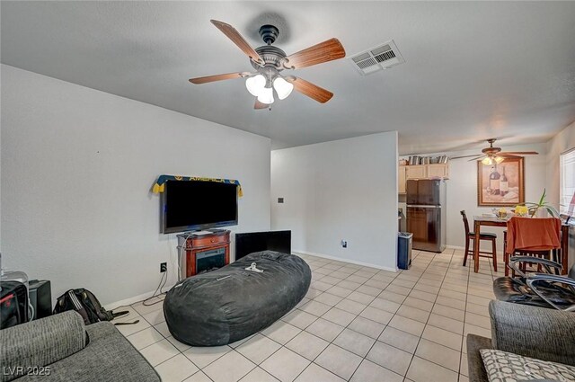 4 Britz Cir, North Las Vegas, NV 89030 - living room featuring ceiling fan, light tile patterned floors, and baseboards