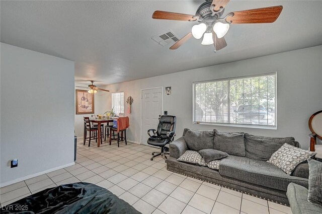 4 Britz Cir, North Las Vegas, NV 89030 - living area featuring a ceiling fan and light tile patterned floors