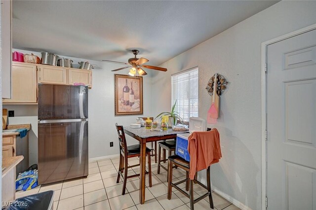 4 Britz Cir, North Las Vegas, NV 89030 - dining area featuring a ceiling fan, baseboards, and light tile patterned floors