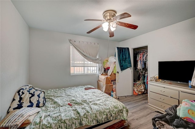 4 Britz Cir, North Las Vegas, NV 89030 - bedroom with wood finished floors, a closet, ceiling fan, and a walk in closet
