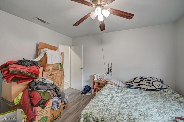4 Britz Cir, North Las Vegas, NV 89030 - bedroom with wood finished floors and ceiling fan
