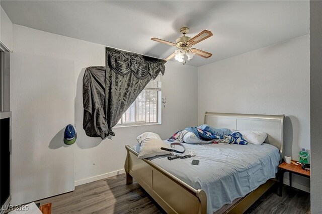 4 Britz Cir, North Las Vegas, NV 89030 - bedroom featuring wood finished floors, a ceiling fan, and baseboards