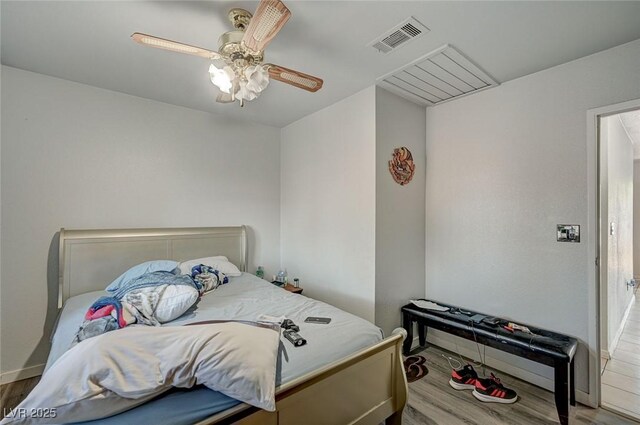 4 Britz Cir, North Las Vegas, NV 89030 - bedroom with wood finished floors, baseboards, and a ceiling fan