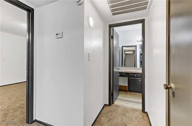 1390 Vegas Valley Dr Unit 32, Las Vegas, NV 89169 - hall with light colored carpet and baseboards
