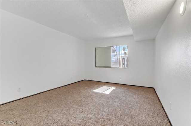 1390 Vegas Valley Dr Unit 32, Las Vegas, NV 89169 - empty room featuring carpet floors, a textured ceiling, and baseboards