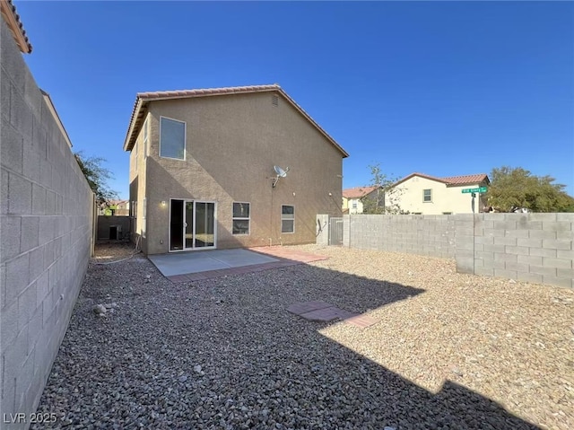7249 Old Glory St, Las Vegas, NV 89148 - rear view of house featuring stucco siding, a fenced backyard, a patio, and central AC