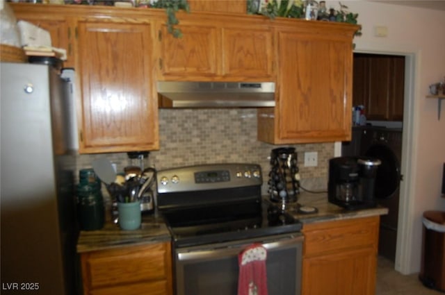 30 Diamond Bar Rd, Pahrump, NV 89048 - kitchen with stainless steel appliances, under cabinet range hood, tasteful backsplash, and brown cabinetry