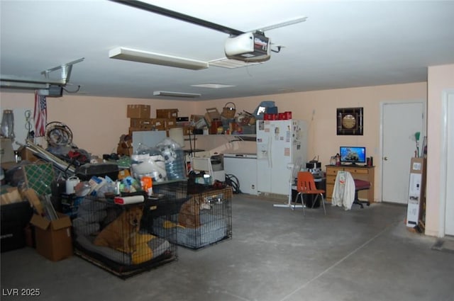 30 Diamond Bar Rd, Pahrump, NV 89048 - garage featuring white fridge with ice dispenser, a garage door opener, and washer / dryer