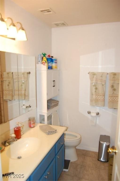 30 Diamond Bar Rd, Pahrump, NV 89048 - bathroom with vanity, toilet, and tile patterned floors