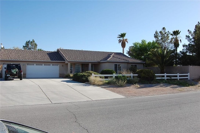 30 Diamond Bar Rd, Pahrump, NV 89048 - ranch-style home featuring an attached garage, driveway, and stucco siding