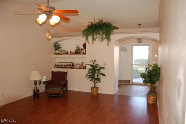 30 Diamond Bar Rd, Pahrump, NV 89048 - sitting room with arched walkways, ceiling fan, and wood finished floors