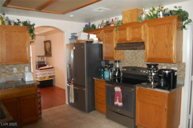 30 Diamond Bar Rd, Pahrump, NV 89048 - kitchen with appliances with stainless steel finishes, under cabinet range hood, arched walkways, and tasteful backsplash