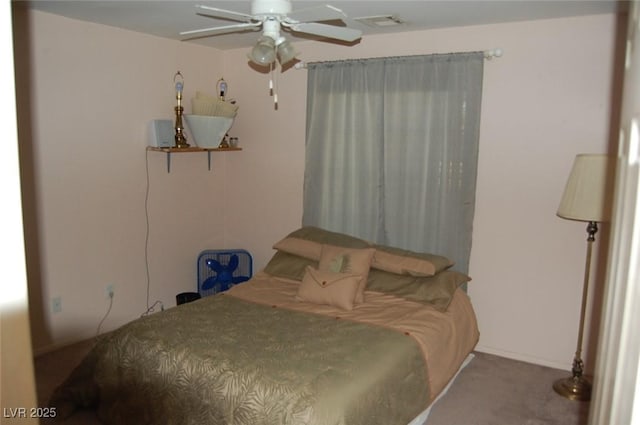 30 Diamond Bar Rd, Pahrump, NV 89048 - carpeted bedroom with a ceiling fan and baseboards
