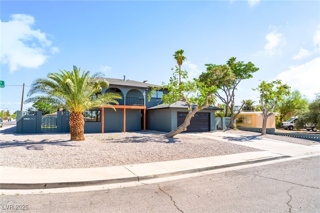 2180 Palora Ave, Las Vegas, NV 89169 - view of front of home featuring driveway, stucco siding, a balcony, and an attached garage