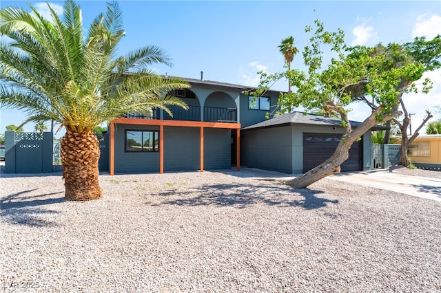 2180 Palora Ave, Las Vegas, NV 89169 - view of front of property with a balcony, driveway, and stucco siding