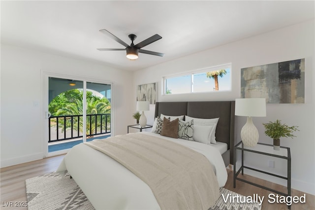 2180 Palora Ave, Las Vegas, NV 89169 - bedroom with access to exterior, multiple windows, baseboards, and wood finished floors