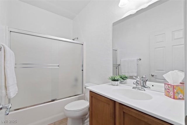 7448 Lintwhite St, North Las Vegas, NV 89084 - bathroom featuring vanity, toilet, shower / bath combination with glass door, and tile patterned flooring