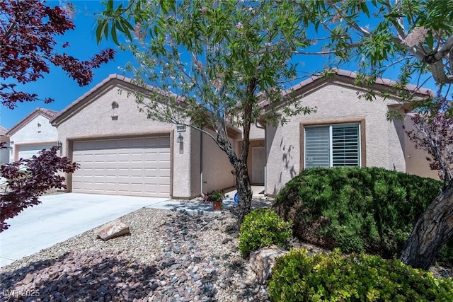 7448 Lintwhite St, North Las Vegas, NV 89084 - ranch-style home with an attached garage, stucco siding, and concrete driveway