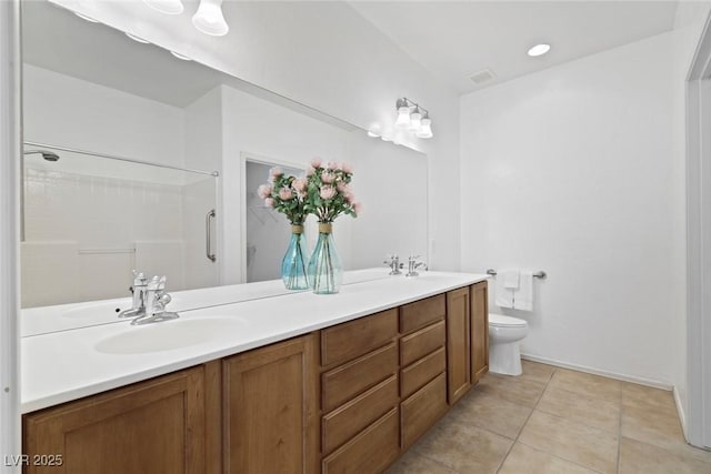 7448 Lintwhite St, North Las Vegas, NV 89084 - bathroom featuring double vanity, toilet, tile patterned floors, a shower, and baseboards