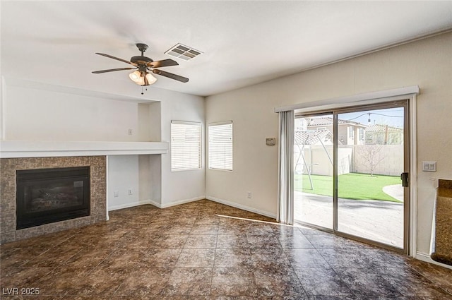 74 Harbor Coast St, Las Vegas, NV 89148 - unfurnished living room with a ceiling fan and a tiled fireplace