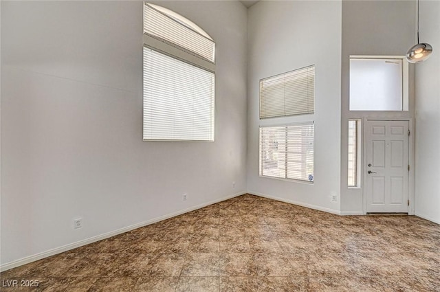 74 Harbor Coast St, Las Vegas, NV 89148 - carpeted foyer entrance featuring a high ceiling and baseboards