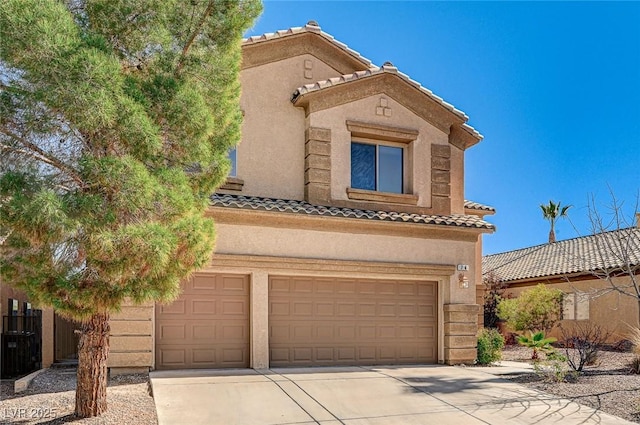 74 Harbor Coast St, Las Vegas, NV 89148 - view of front facade with a tile roof, driveway, a garage, and stucco siding