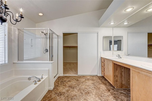 74 Harbor Coast St, Las Vegas, NV 89148 - bathroom featuring a stall shower, lofted ceiling, a garden tub, a spacious closet, and double vanity