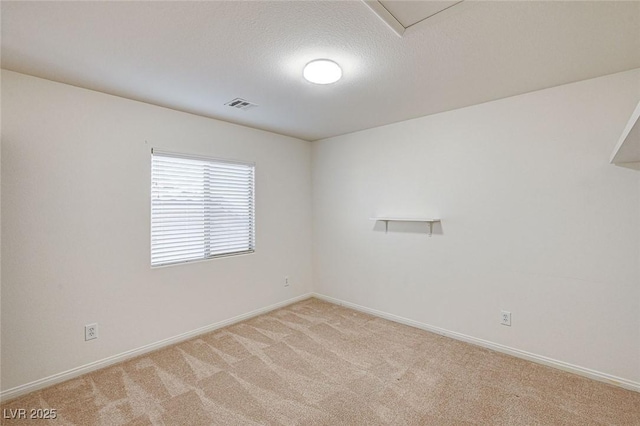 74 Harbor Coast St, Las Vegas, NV 89148 - spare room featuring light colored carpet, baseboards, and a textured ceiling