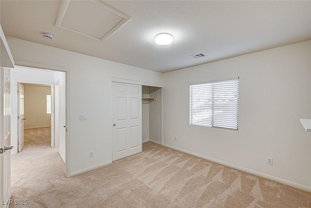 74 Harbor Coast St, Las Vegas, NV 89148 - unfurnished bedroom with light colored carpet, baseboards, a closet, and a textured ceiling