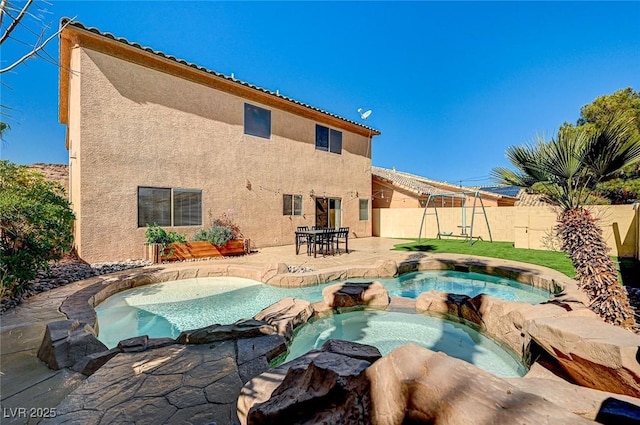 74 Harbor Coast St, Las Vegas, NV 89148 - view of pool featuring a pool with connected hot tub, a patio area, and a fenced backyard