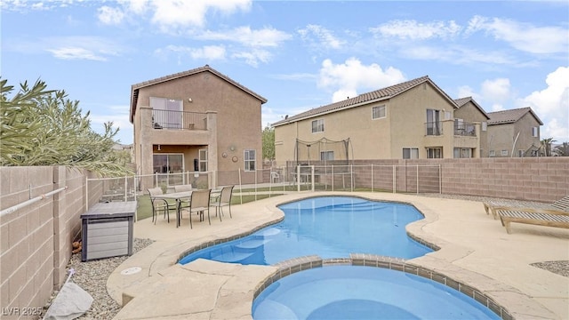 482 Painted Sage Ct, Henderson, NV 89015 - view of swimming pool featuring a fenced backyard, a patio area, and a pool with connected hot tub