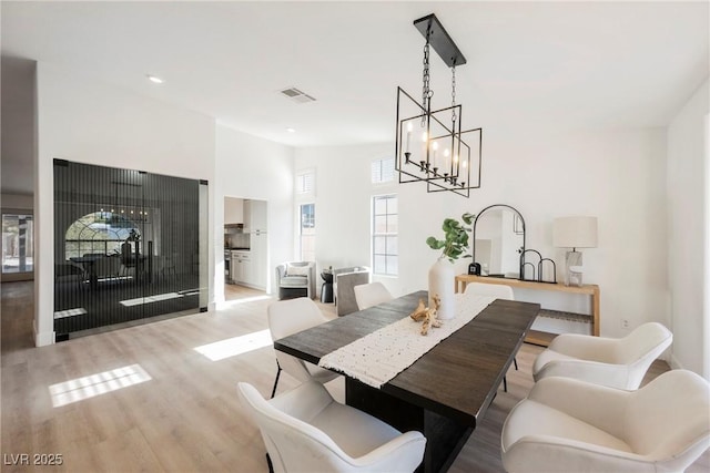 4016 Tyler William Ln, Las Vegas, NV 89130 - dining space with wood finished floors, a chandelier, and recessed lighting