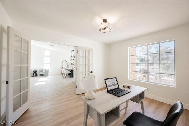 4016 Tyler William Ln, Las Vegas, NV 89130 - office area with french doors, light wood-style floors, a chandelier, and baseboards