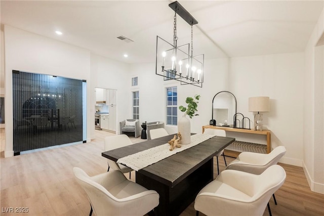 4016 Tyler William Ln, Las Vegas, NV 89130 - dining space featuring light wood-style floors, a chandelier, baseboards, and recessed lighting