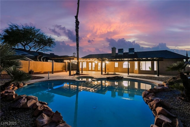 4016 Tyler William Ln, Las Vegas, NV 89130 - pool at dusk featuring a patio area and a pool with connected hot tub