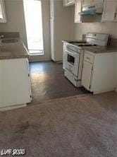 1405 Vegas Valley Dr Unit 360, Las Vegas, NV 89169 - kitchen with gas range gas stove, under cabinet range hood, healthy amount of natural light, and white cabinets