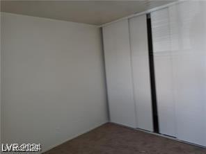 1405 Vegas Valley Dr Unit 360, Las Vegas, NV 89169 - empty room with dark colored carpet