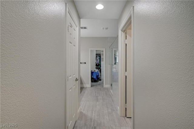 8128 Devils Canyon St, North Las Vegas, NV 89085 - hall featuring a textured wall and baseboards