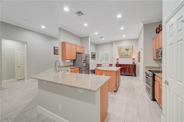 8128 Devils Canyon St, North Las Vegas, NV 89085 - kitchen with appliances with stainless steel finishes, a sink, a center island, light tile patterned floors, and recessed lighting